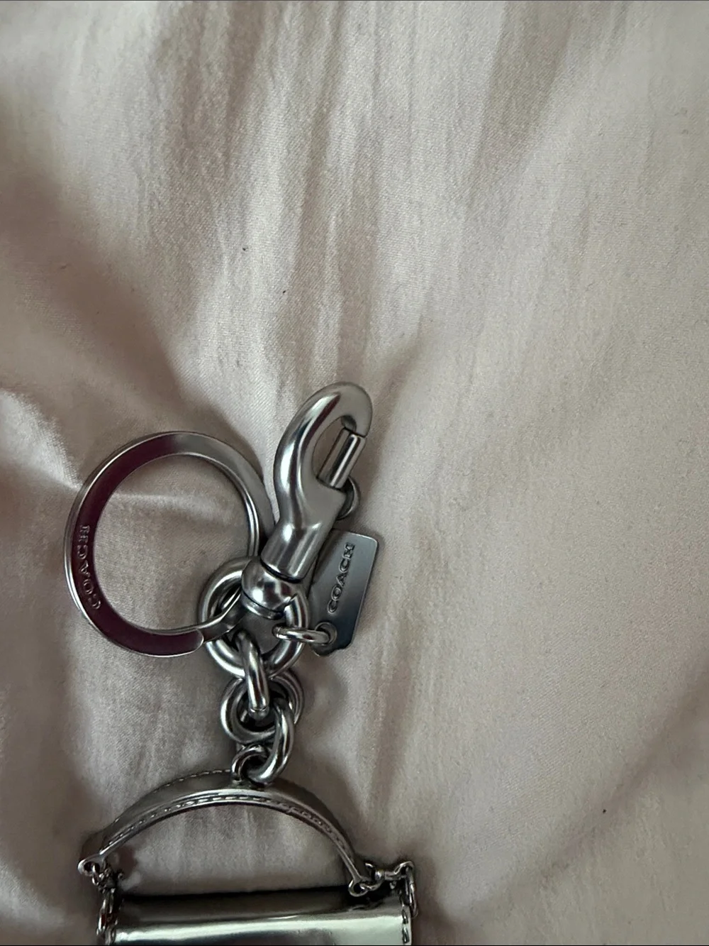 Coach polished silver